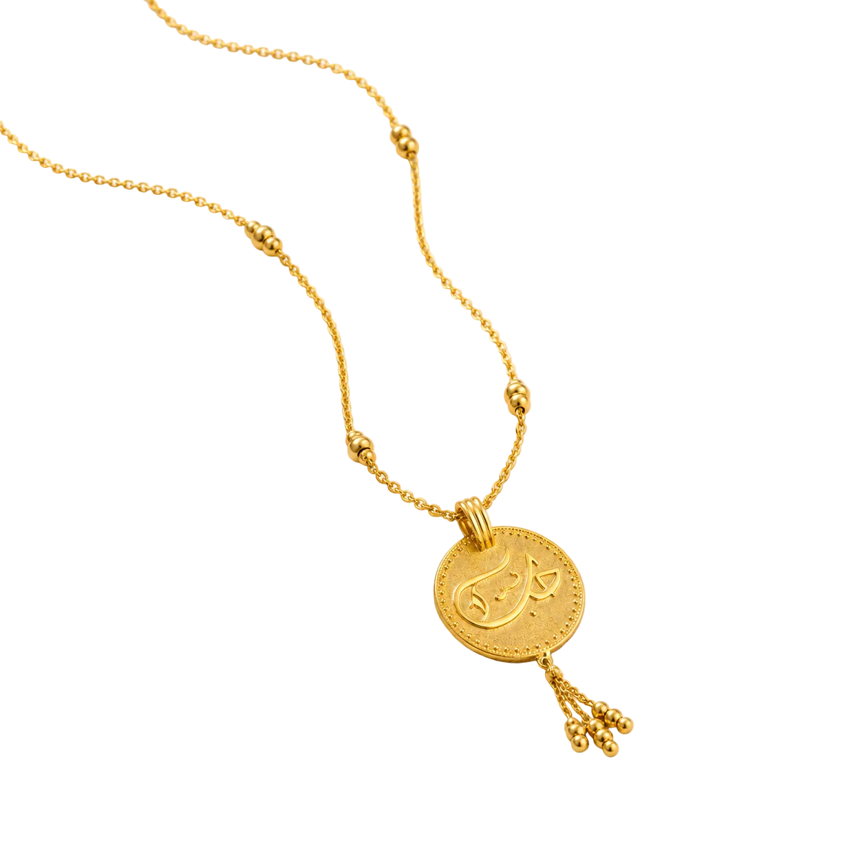 Gold necklace with a round pendant on a white background